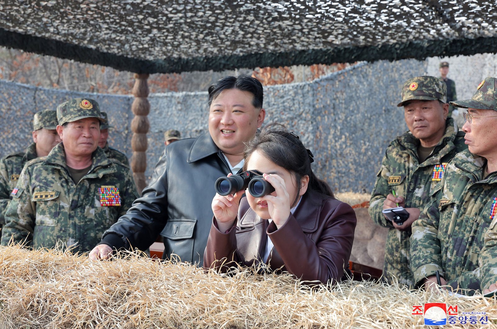 Kim Jong Un with his daughter Kim Ju Ae observing military exercises