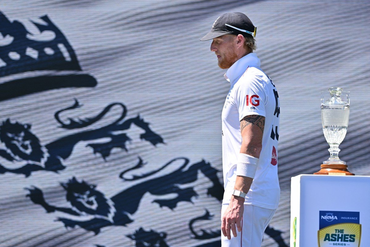 England captain Ben Stokes walking past The Ashes trophy during presentation ceremony