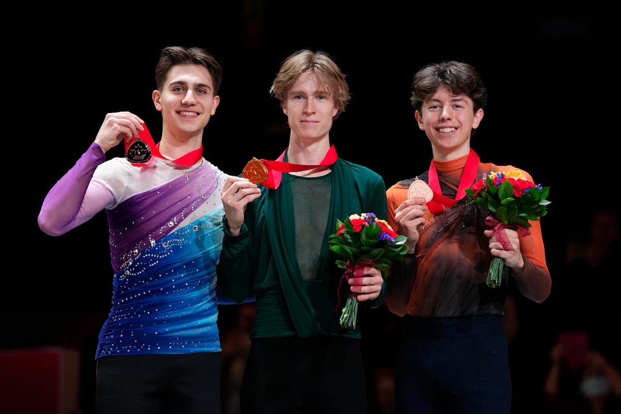 roman Sadovsky (left), Stephen Gogolev (center), Aleksa Rakic (right) holding medals