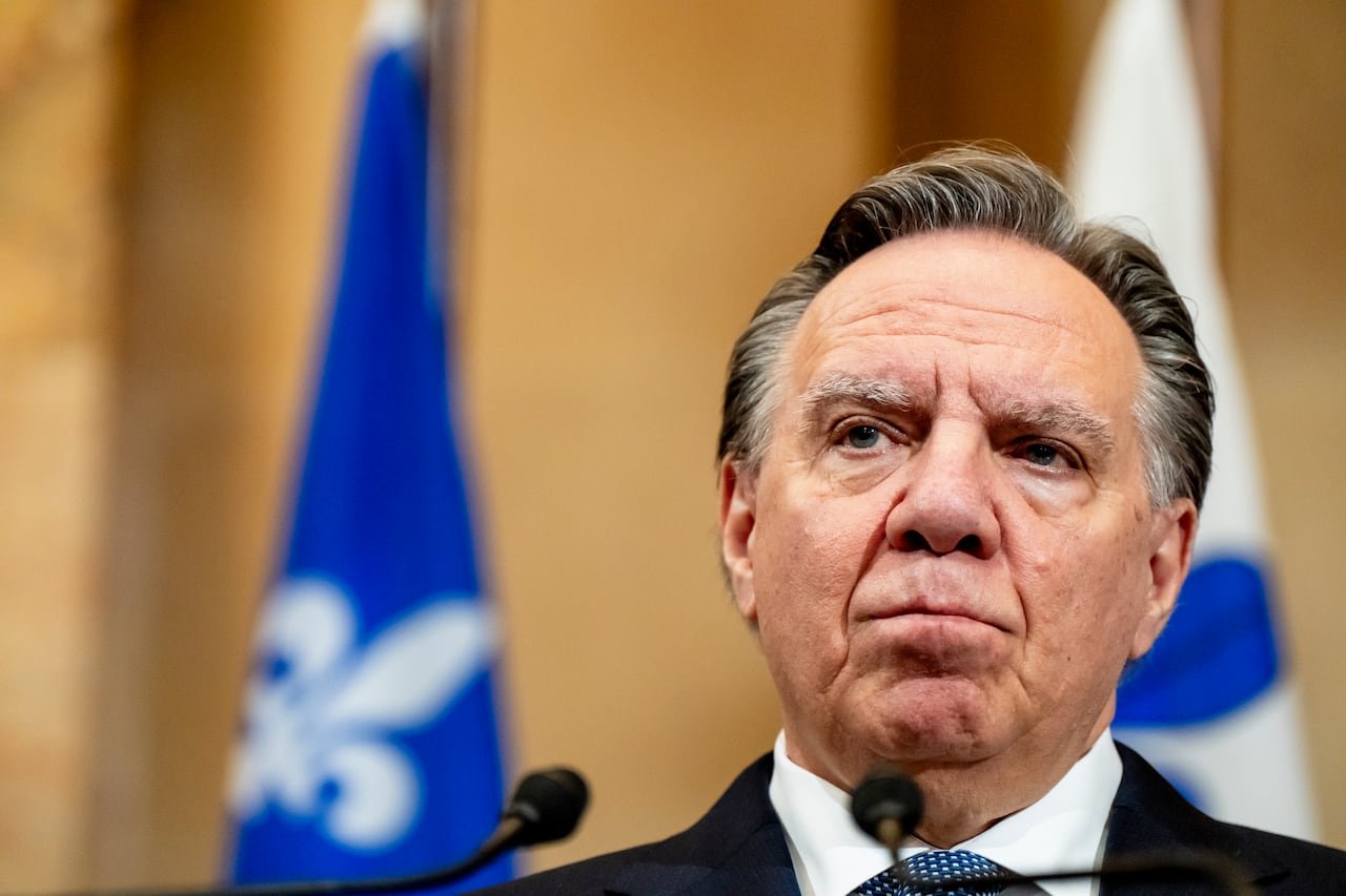 Quebec Premier speaking at podium