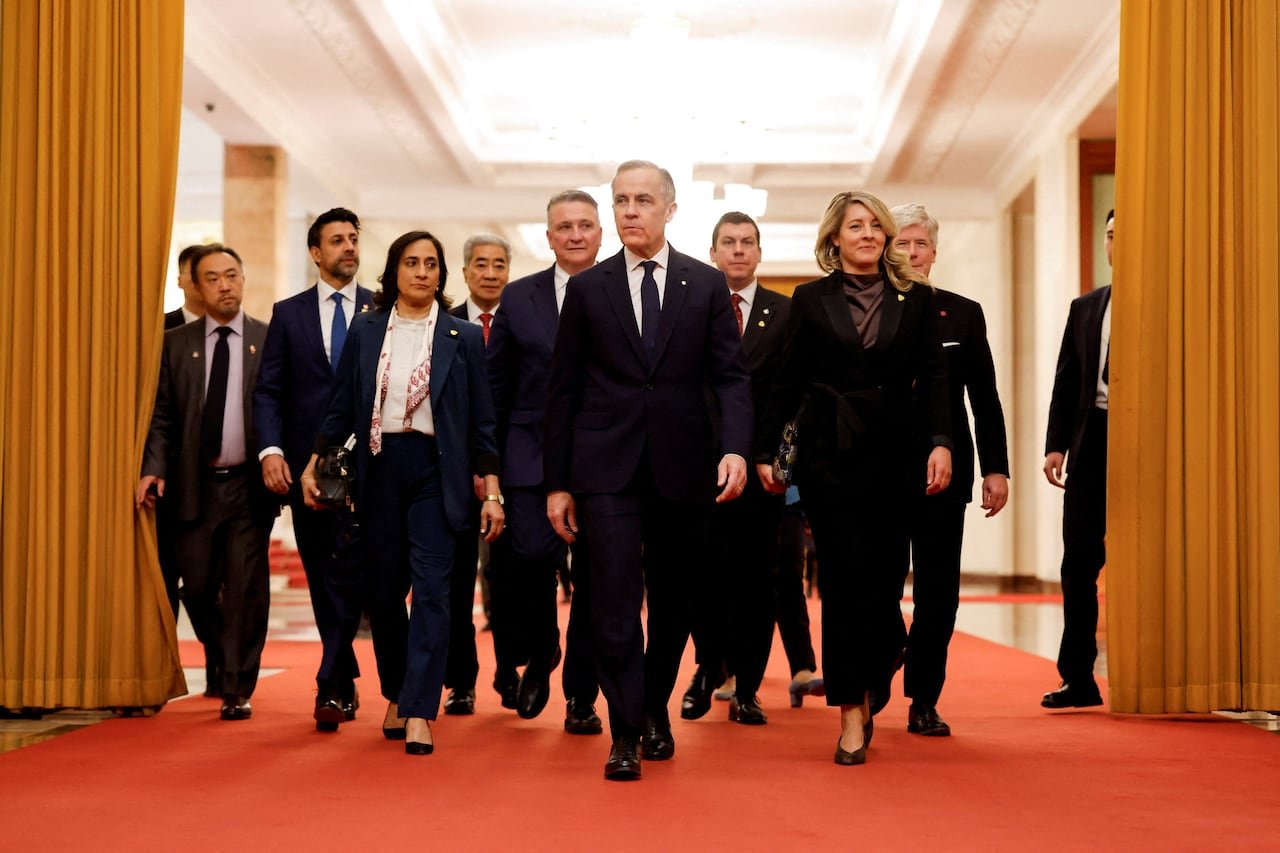 Canadian officials walking inside great Hall of the People