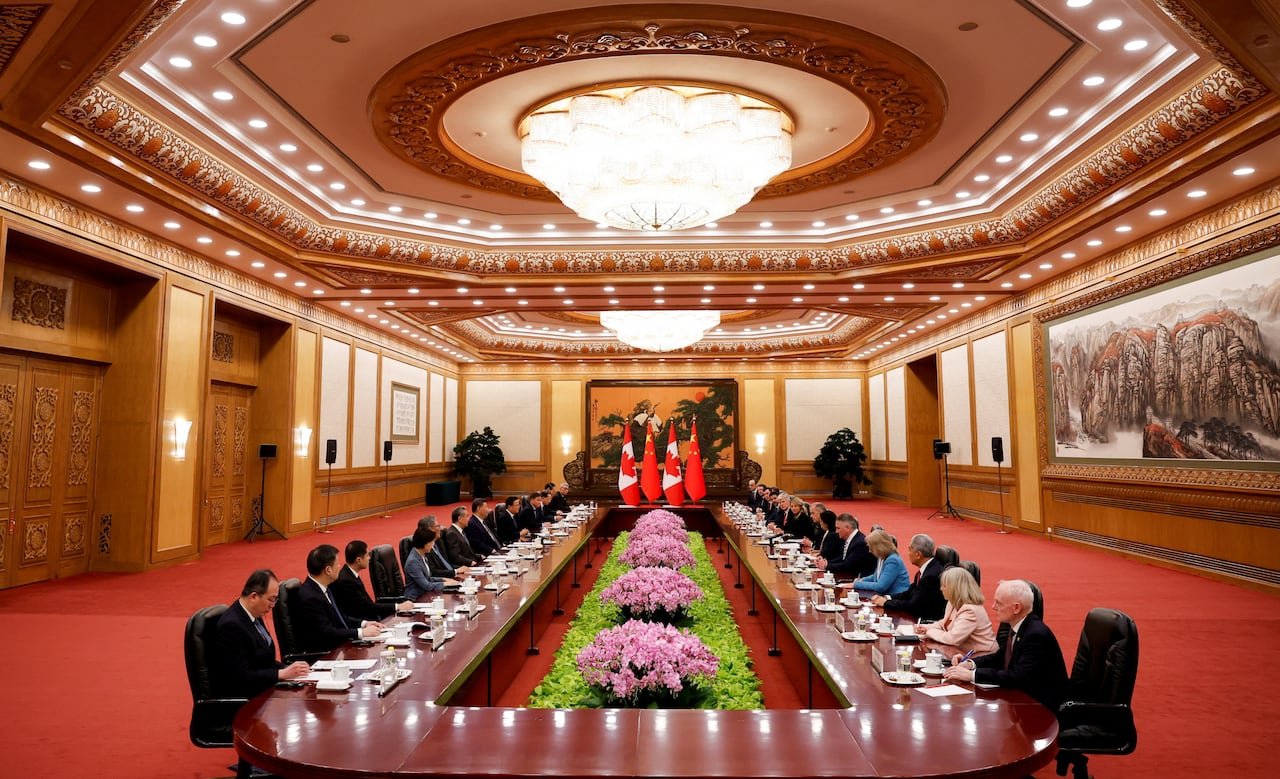 Delegates seated at negotiation table