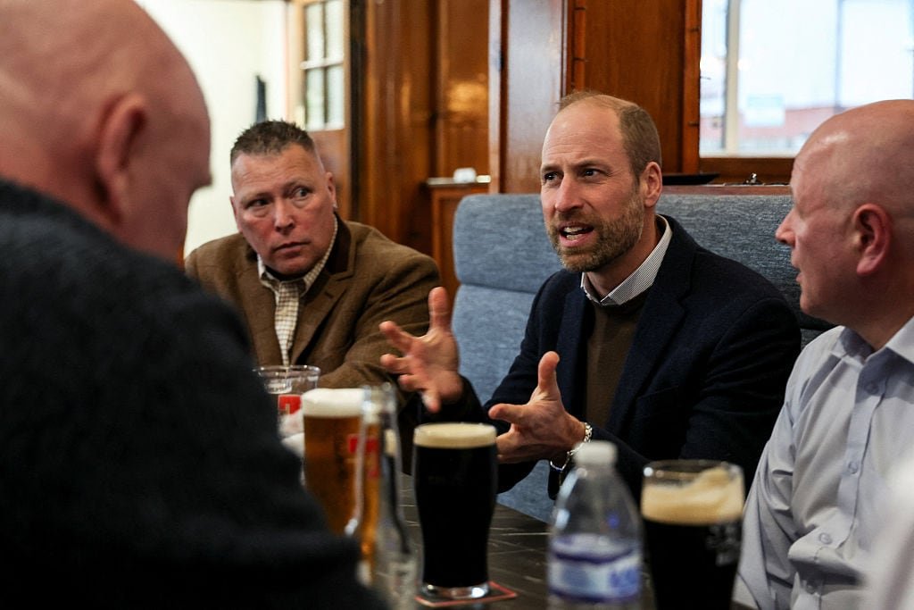 Community pub gathering featuring locals enjoying pints together
