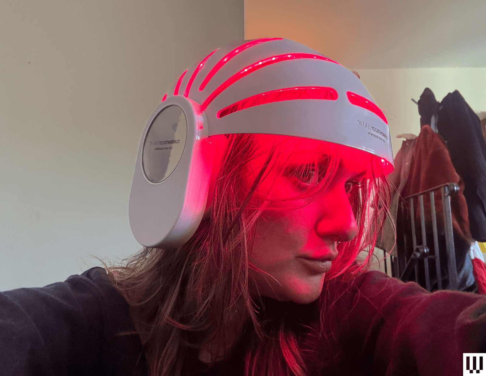 modern LED Hair Growth Helmet placed on charging dock
