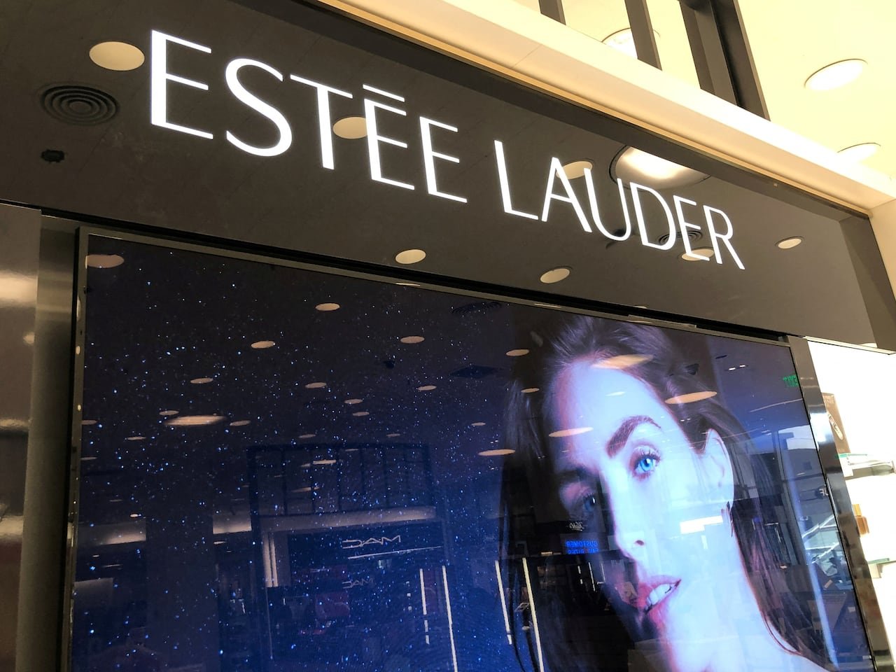 Exterior view showing Estee Lauder store signage