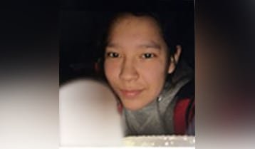 A woman wearing sweater is seen in picture.