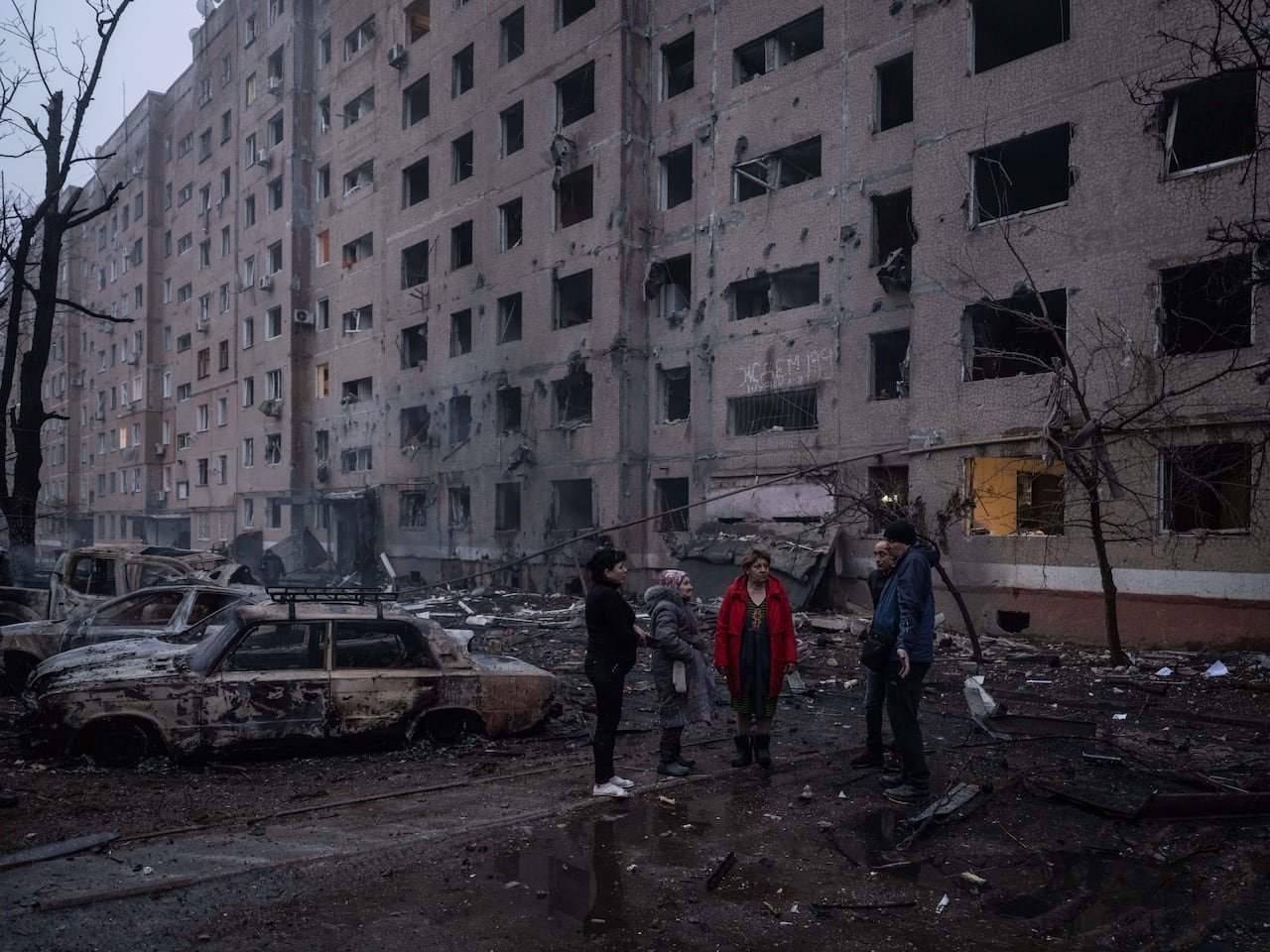 Residents gather amid damage caused by airstrikes in Kramatorsk's residential area