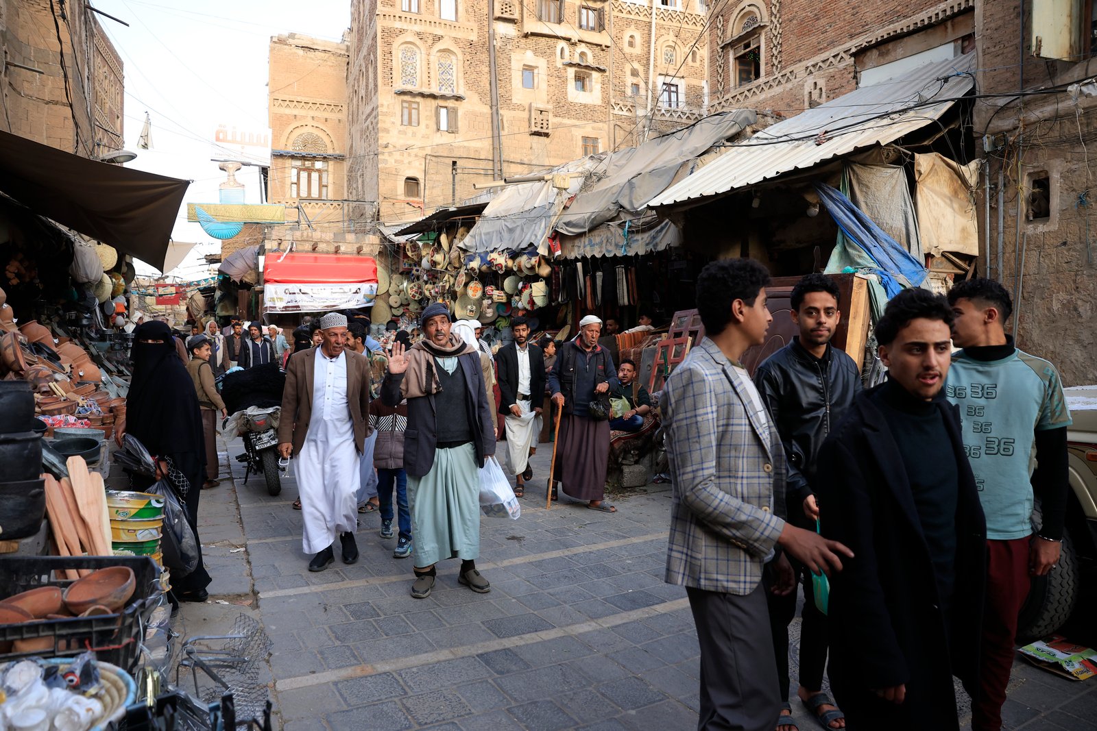 crowds walk thru market ahead of Ramadan fasting month in Sanaa