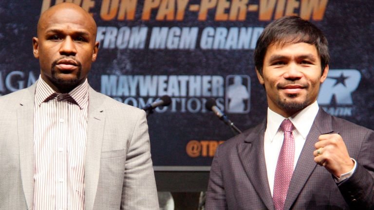 Floyd Mayweather alongside Manny Pacquiao announcing their first fight