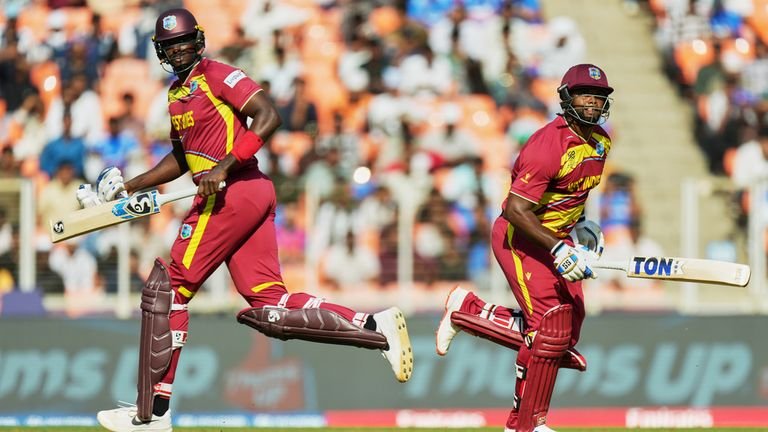 Jason Holder and Romario Shepherd running between wickets during T20 World Cup match