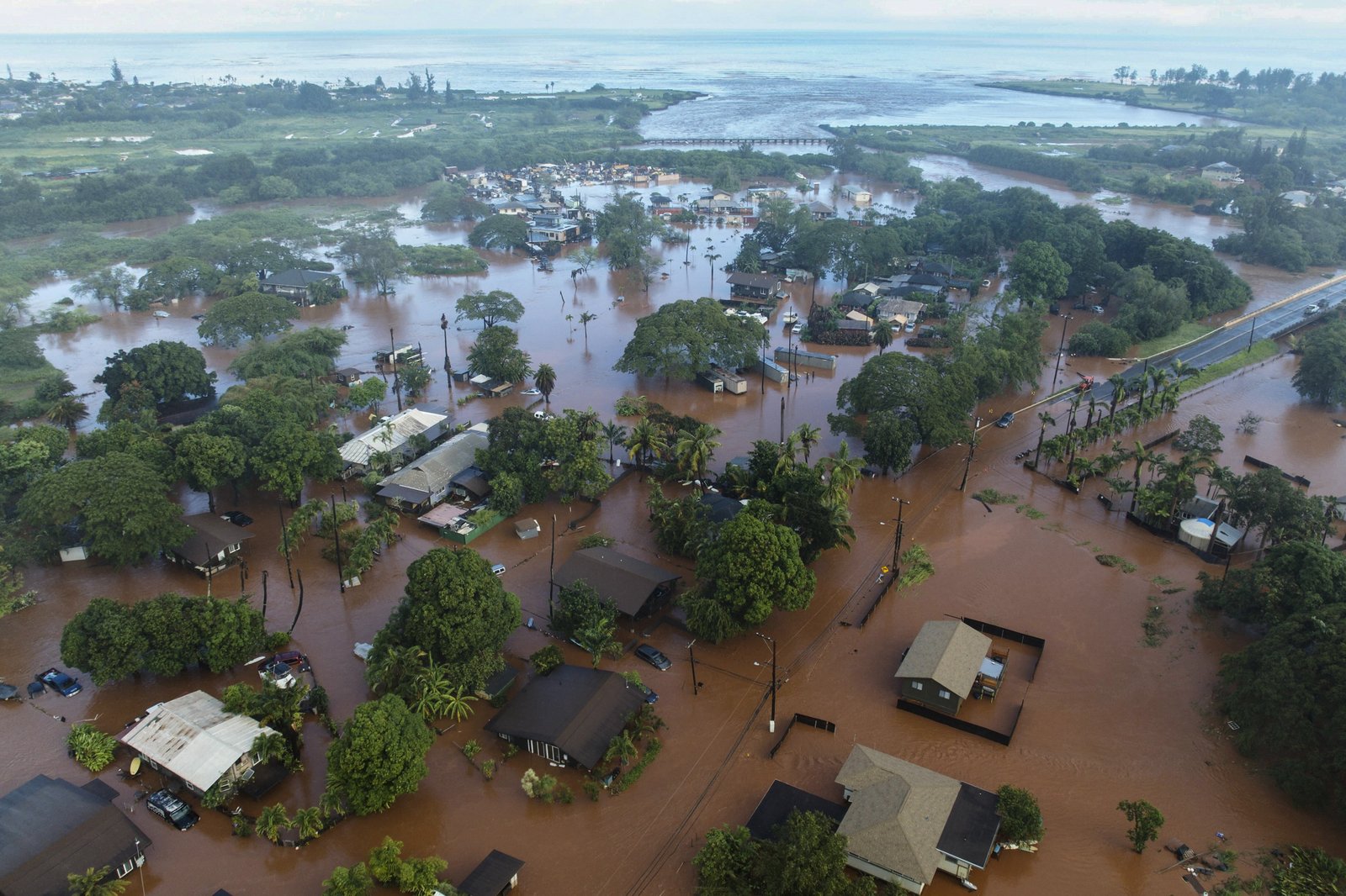 Flooded streets and homes submerged under water in Haleiwa
