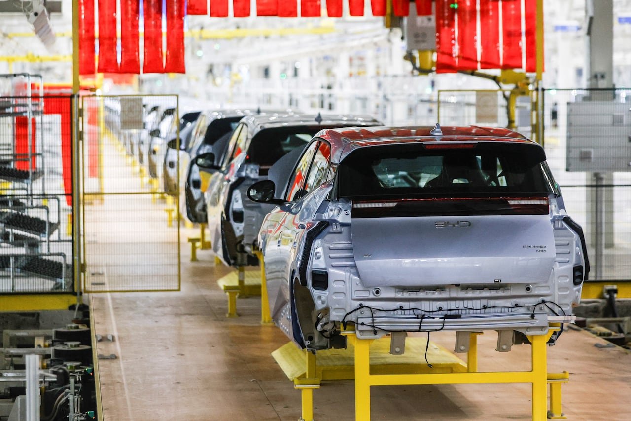 Electric vehicles being assembled at a modern factory