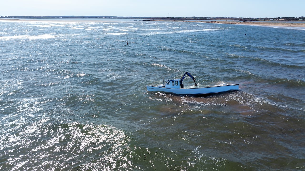 Aerial shot showing two separate distress calls related locations near sinking boat.