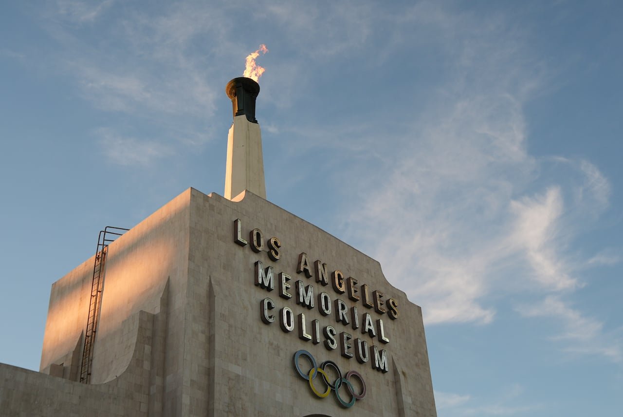 Olympic cauldron burning brightly atop stadium