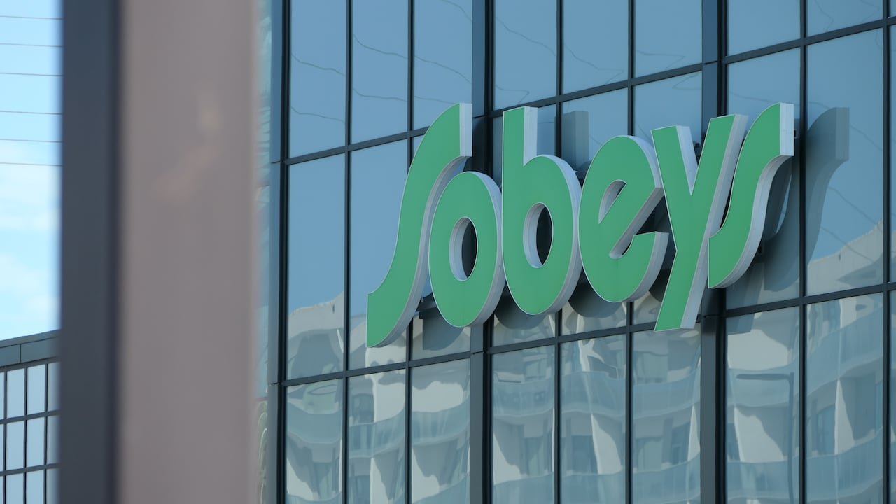 Sobeys grocery store sign on glass exterior wall