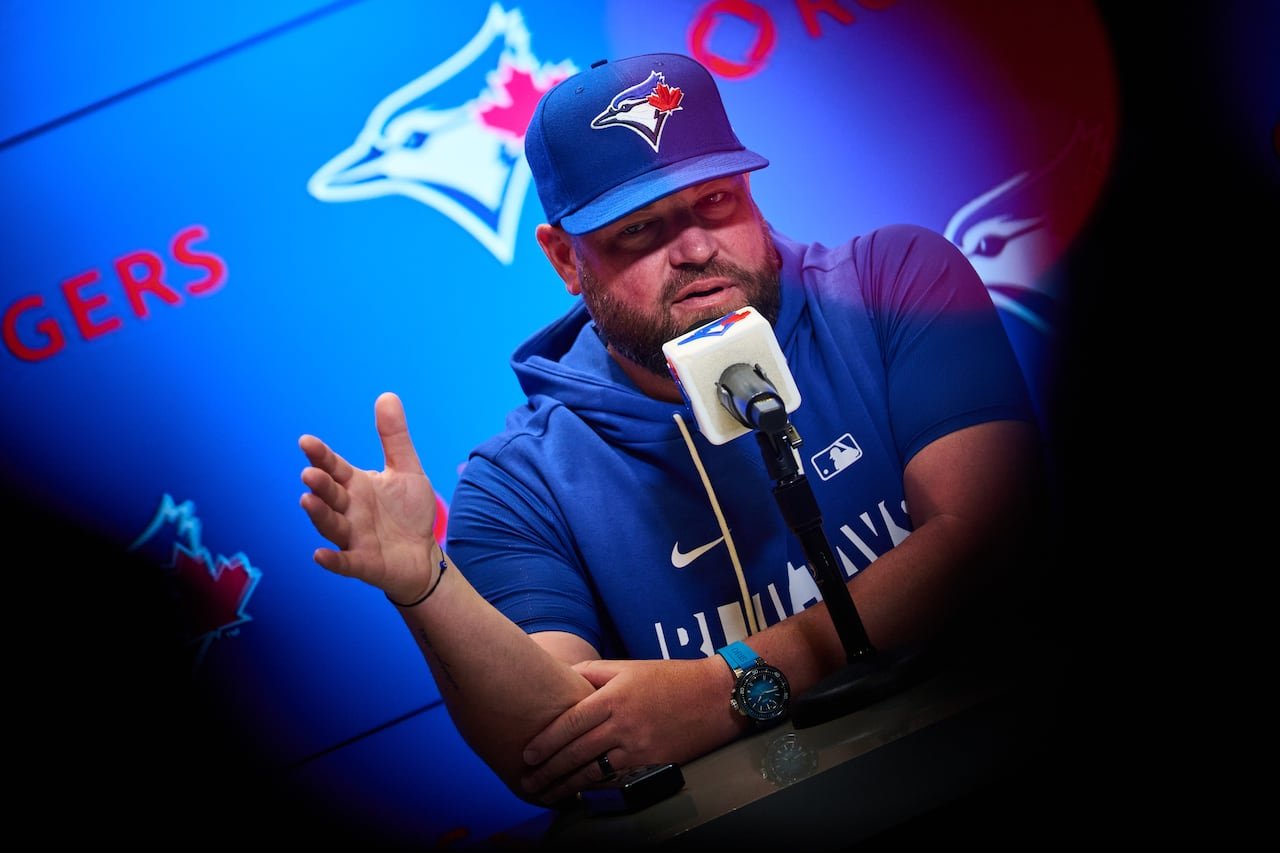Blue Jays manager John Schneider speaking to media