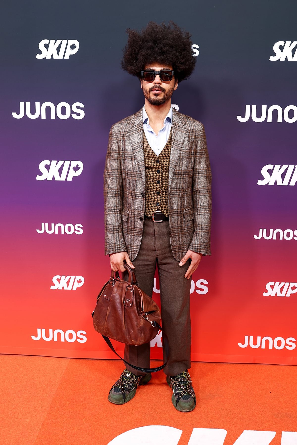 Yves jarvis sporting mixed-pattern tailored suit