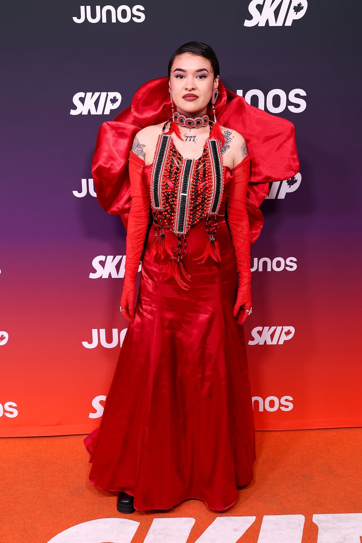 Tia Wood posing in scarlet gown