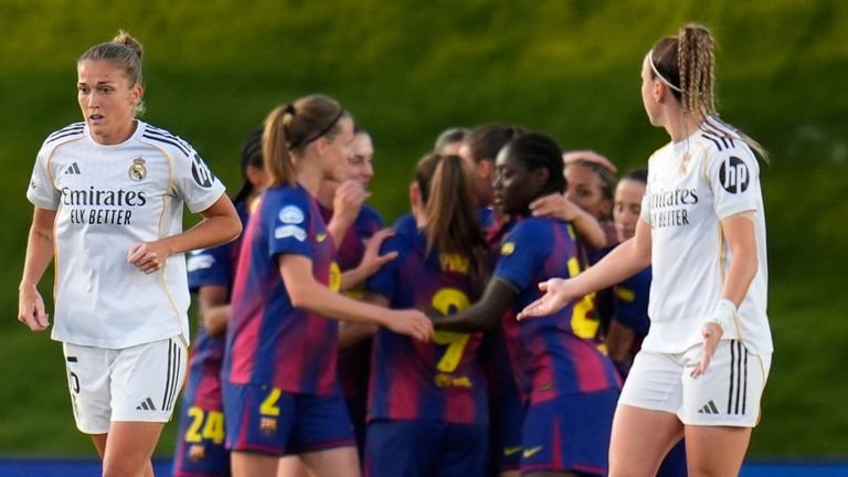 Barcelona players celebrate after scoring against Real Madrid Women
