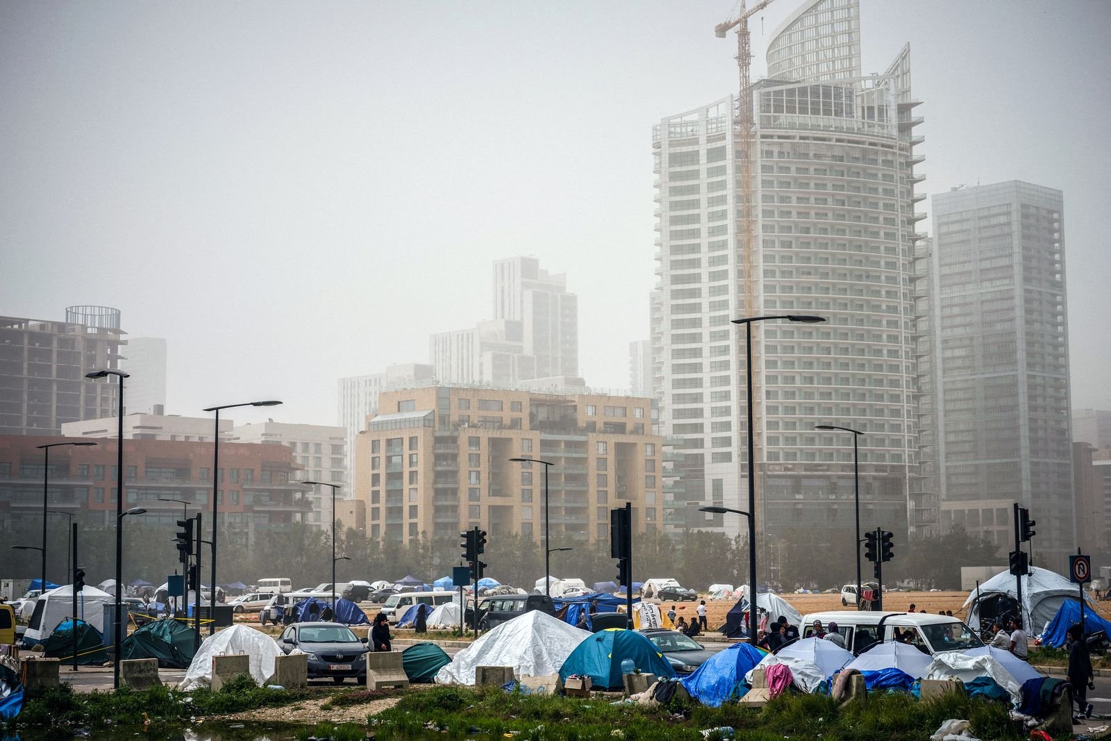 tent camp housing displaced families amid sandstorm