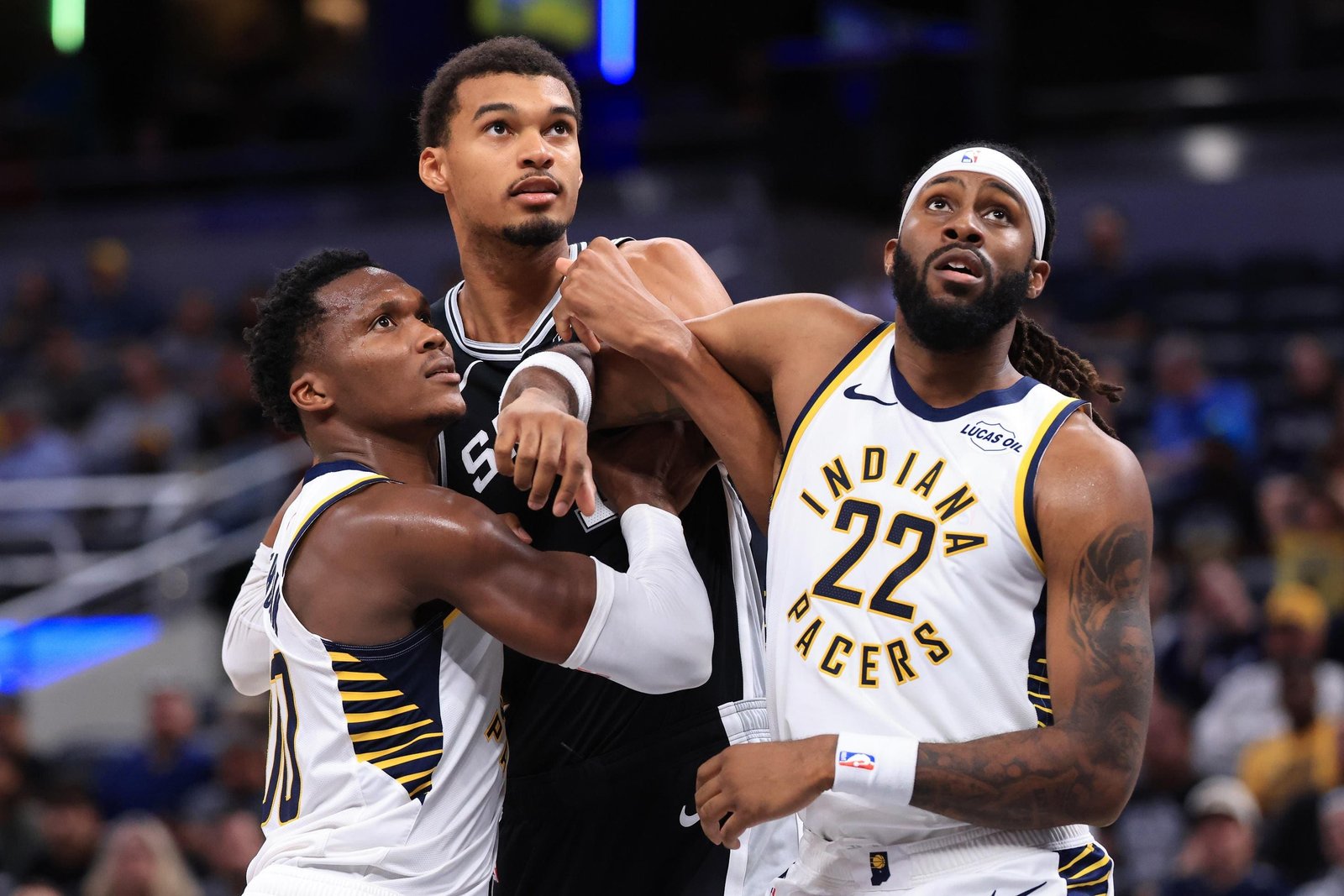Indiana Pacers players defending against San antonio Spurs