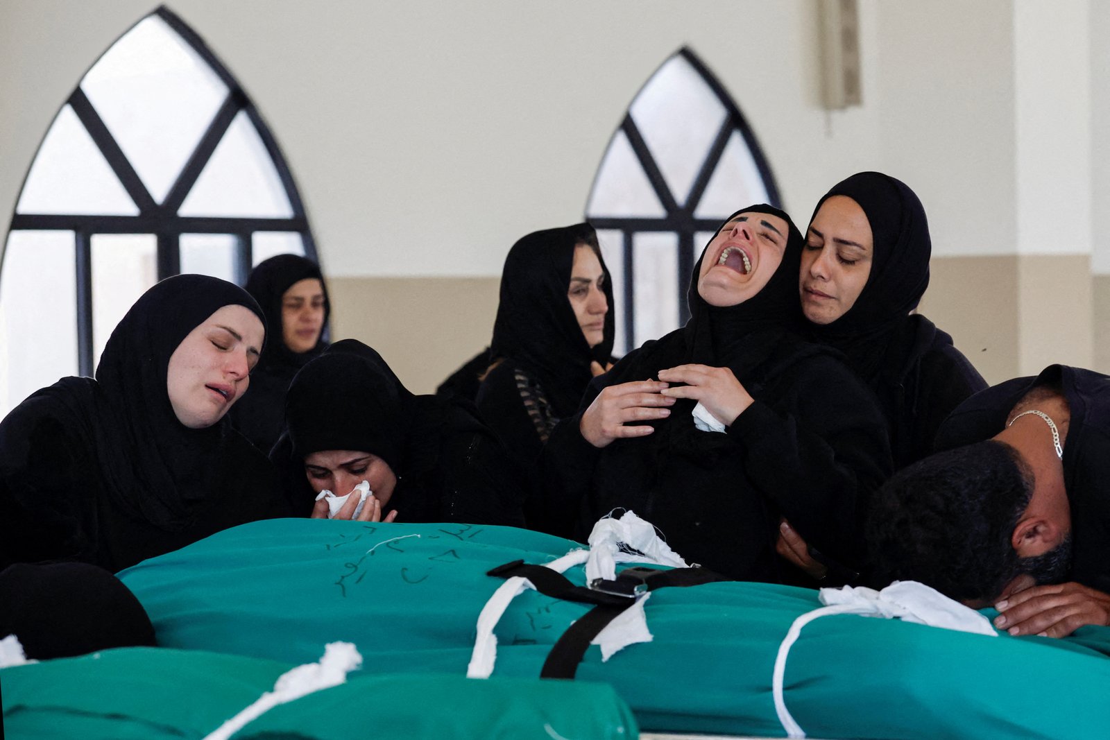 Family members mourning victims killed by airstrike near Sidon, Lebanon