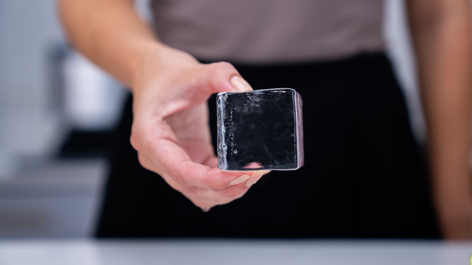 Close-up view of crystal-clear premium cocktail ice