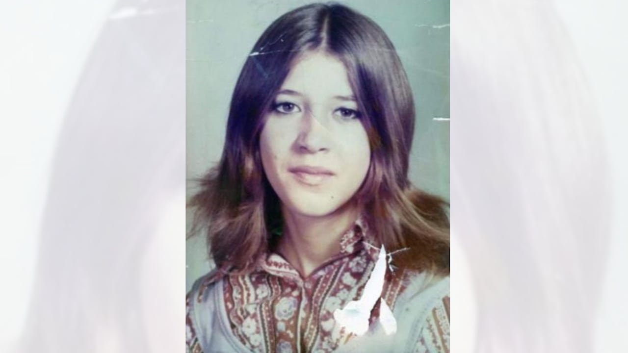 Portrait photo of teenage girl with long dark hair