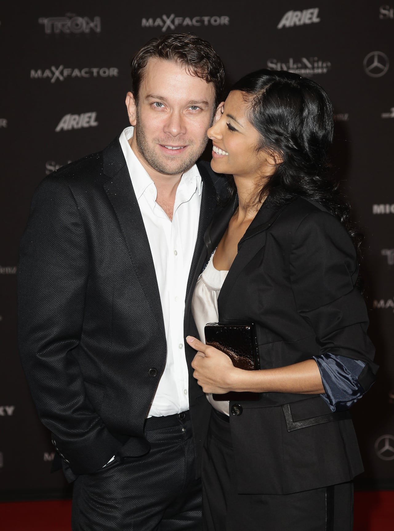 Collien Fernandes standing beside Christian Ulmen smiling