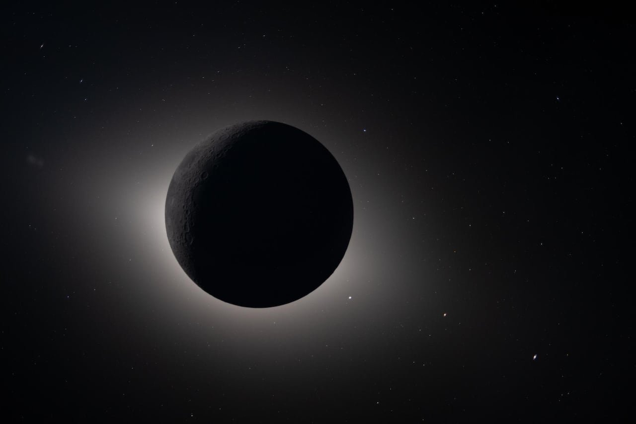 Total solar eclipse showing sun's corona around darkened disk