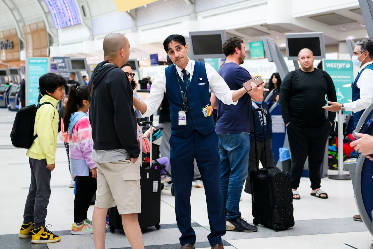 Passengers checking in at airport counter