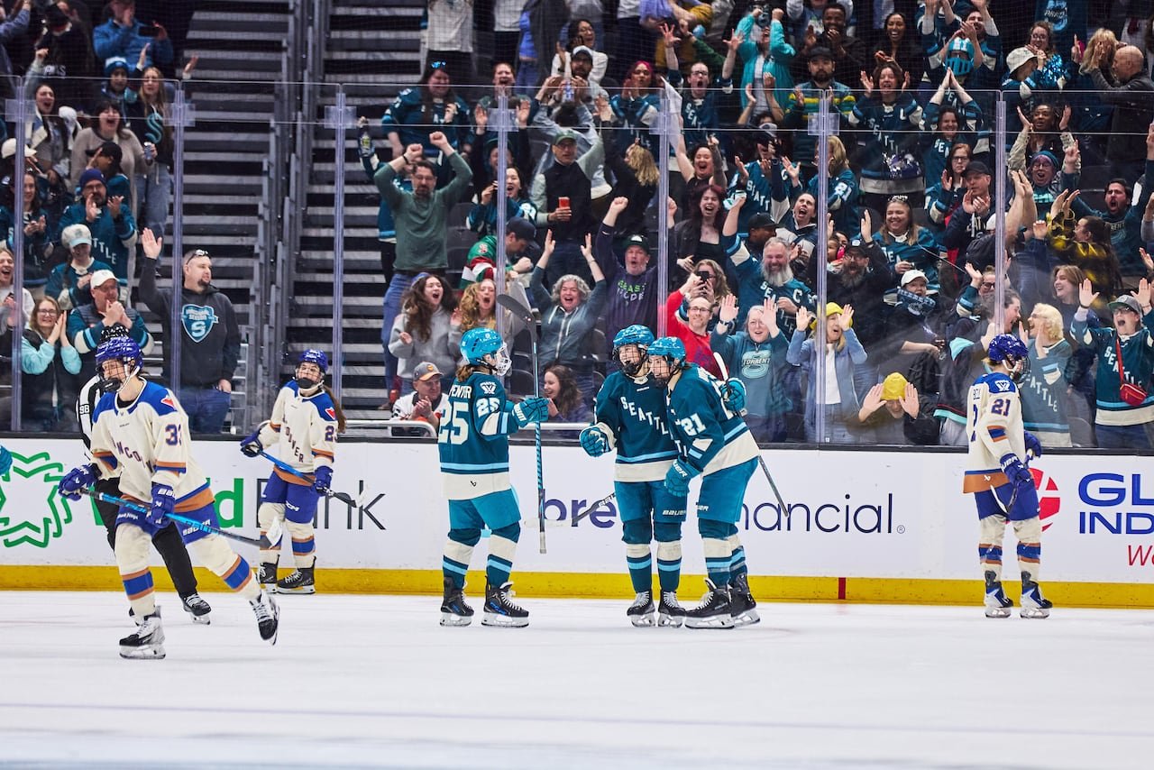Party following goal scored during women's hockey match.