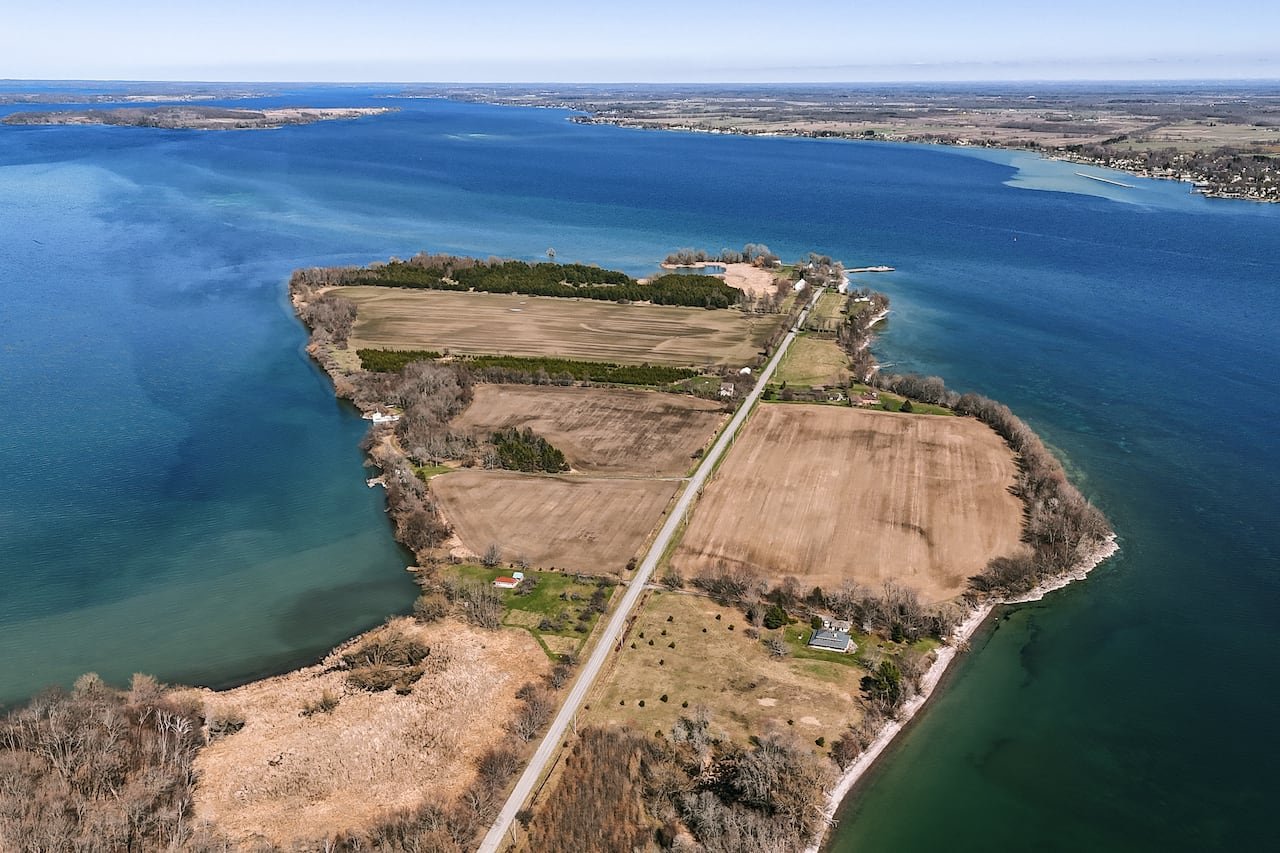 Aerial view showing shoreline erosion near residential properties on Wolfe Island.