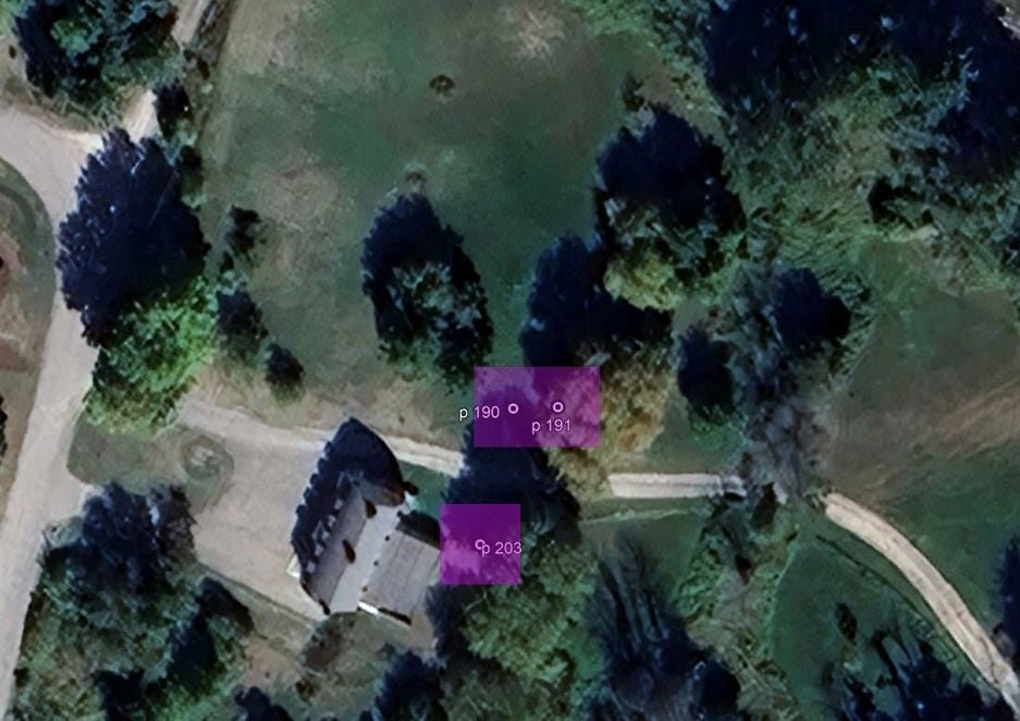 Google Earth aerial image showing three purple squares marking locations where ancestral bones were uncovered.