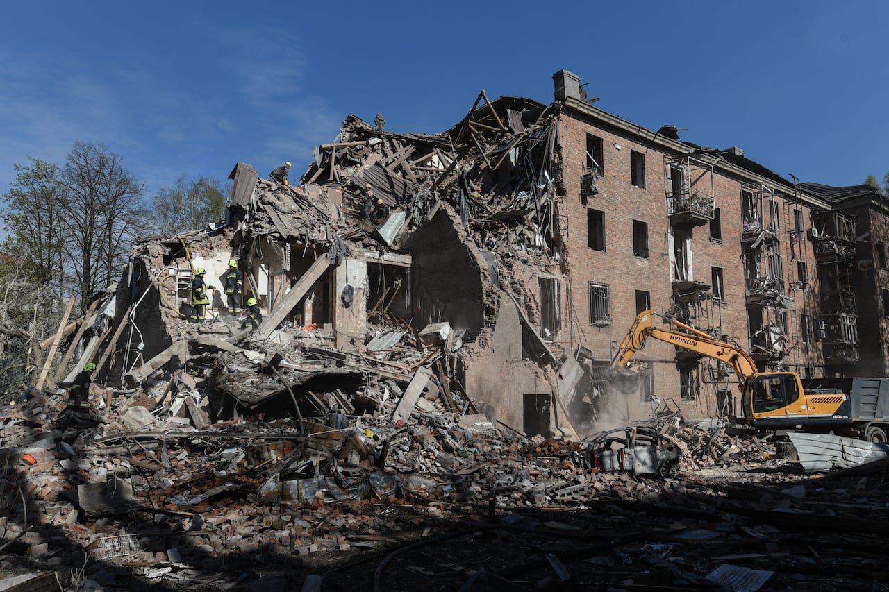 Rescue workers clearing rubble after missile strike in Dnipro