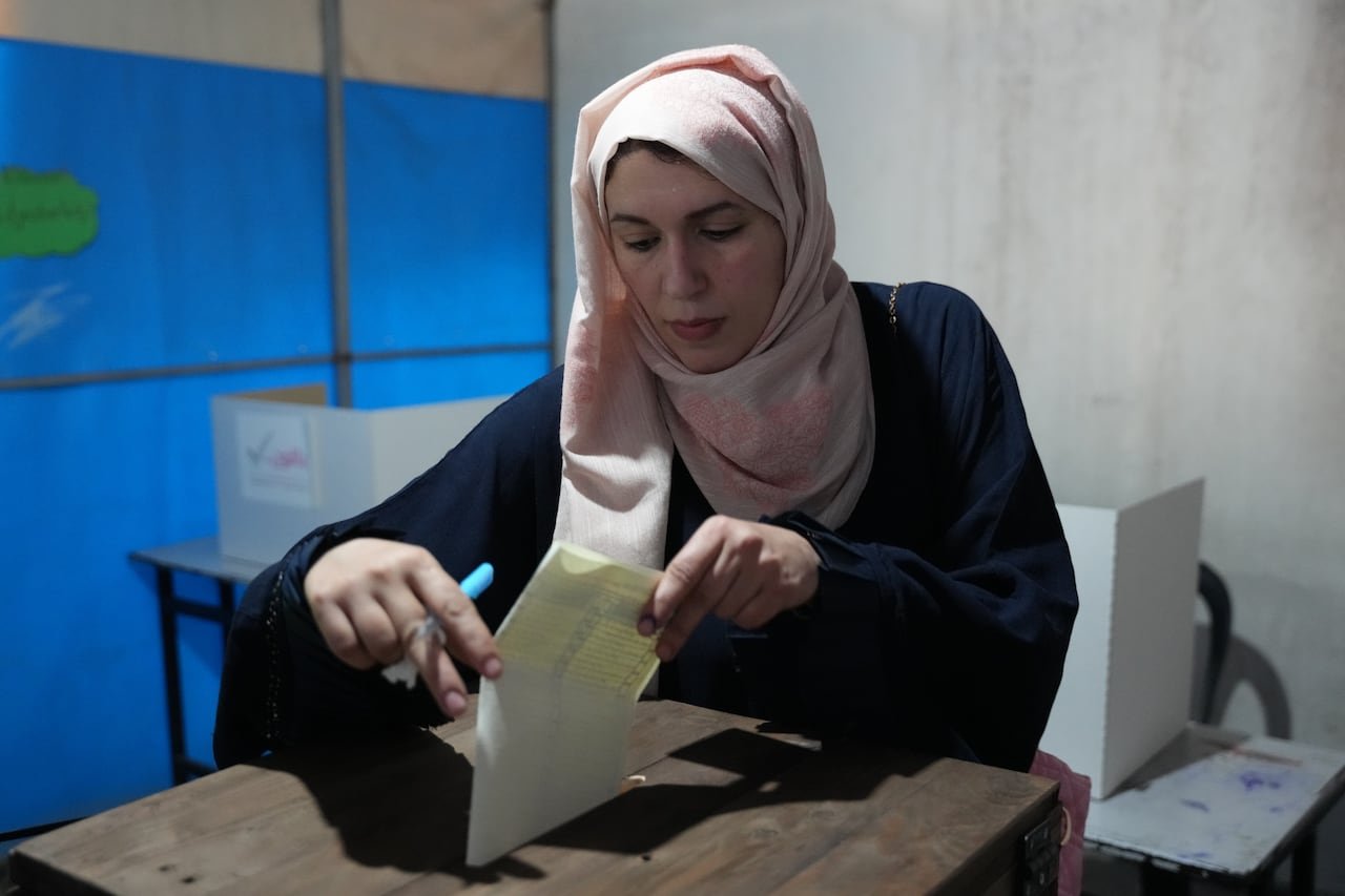 A woman casting her vote at polling station
