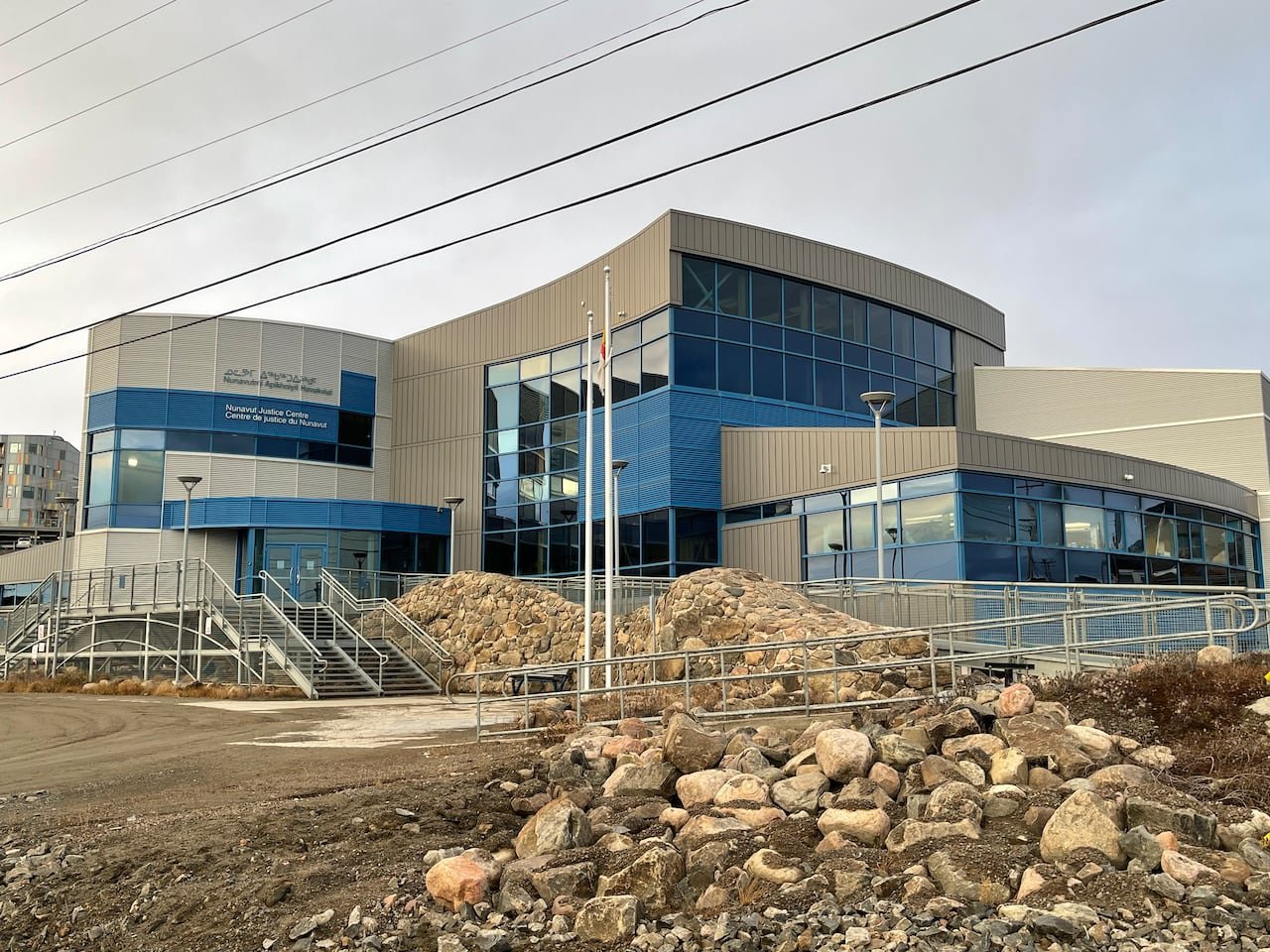 Exterior view of Nunavut Court building surrounded by rocky terrain