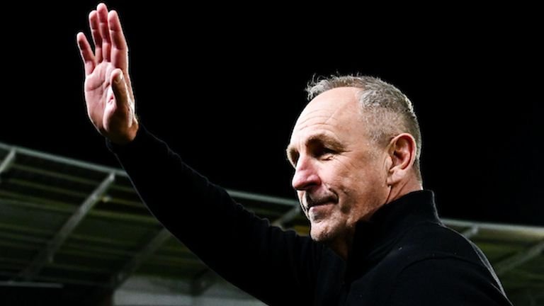 John cartwright receives applause from fans during home match