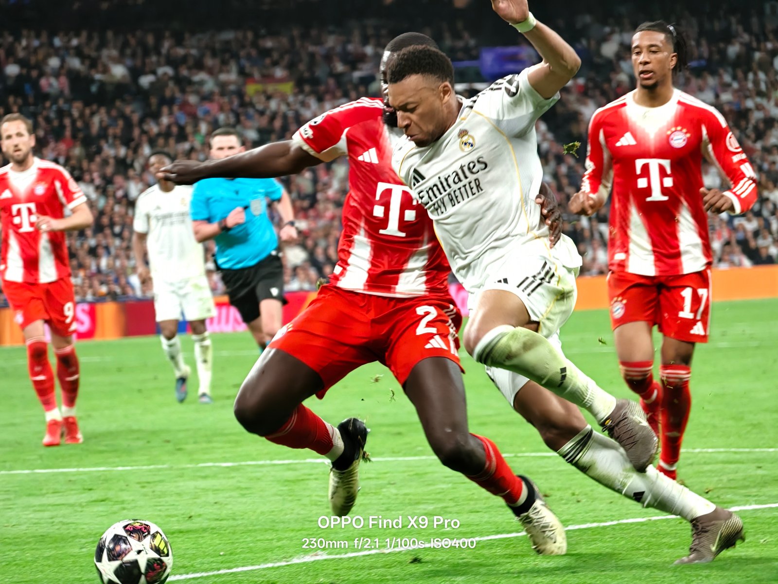 Kylian Mbappe challenges Bayerns defense alongside Michael Olise action shot