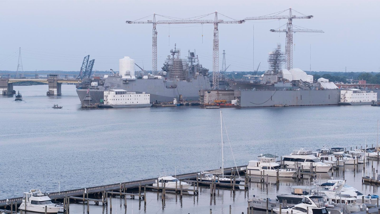 Shipbuilding along Elizabeth River harbor with yachts and boats in Portsmouth and Norfolk, VA