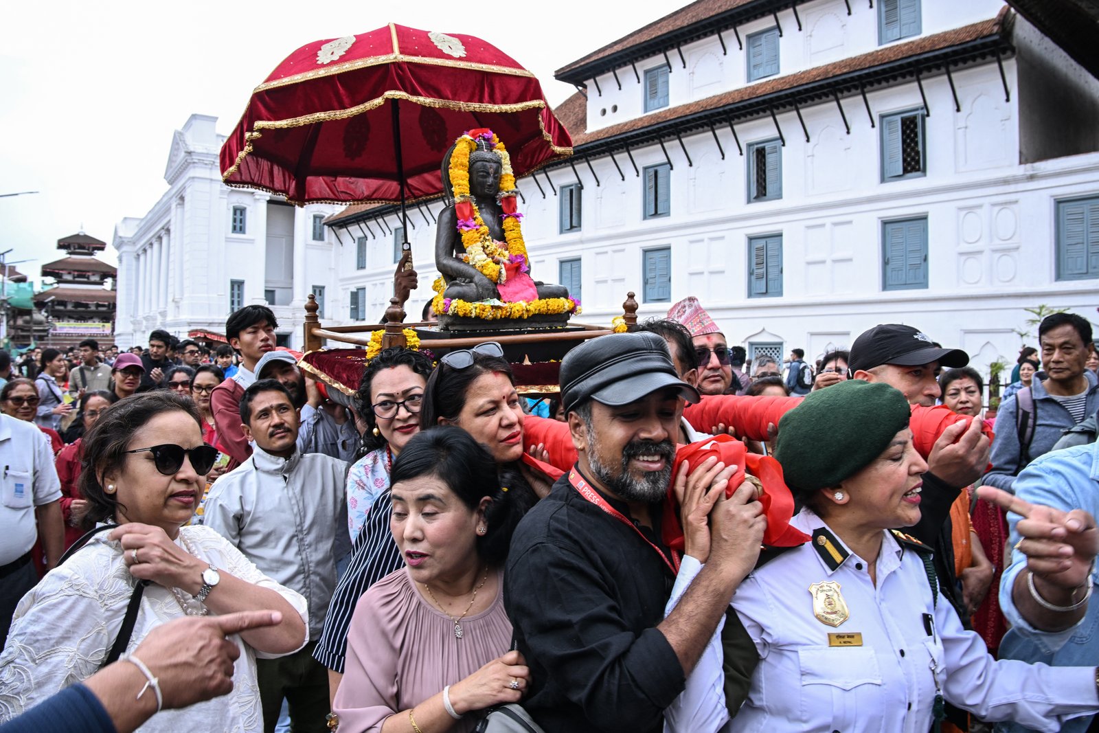 Ceremonial procession with Buddha statue