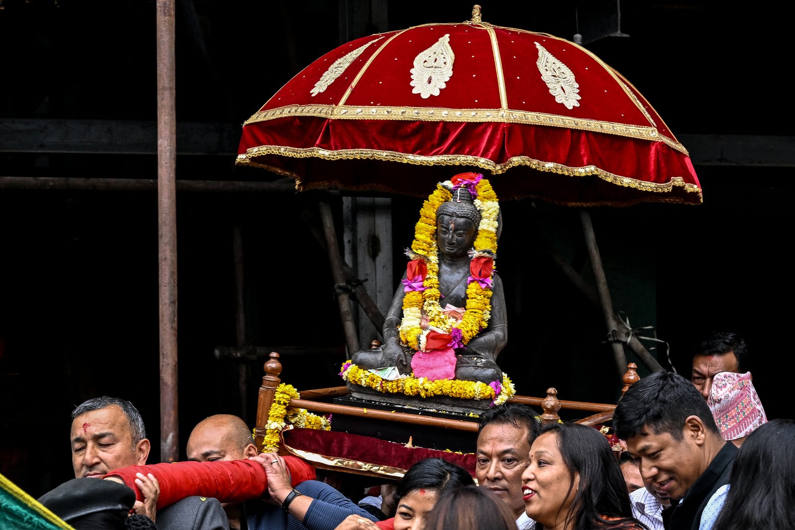 Devotees carrying Buddha sculpture in Kathmandu