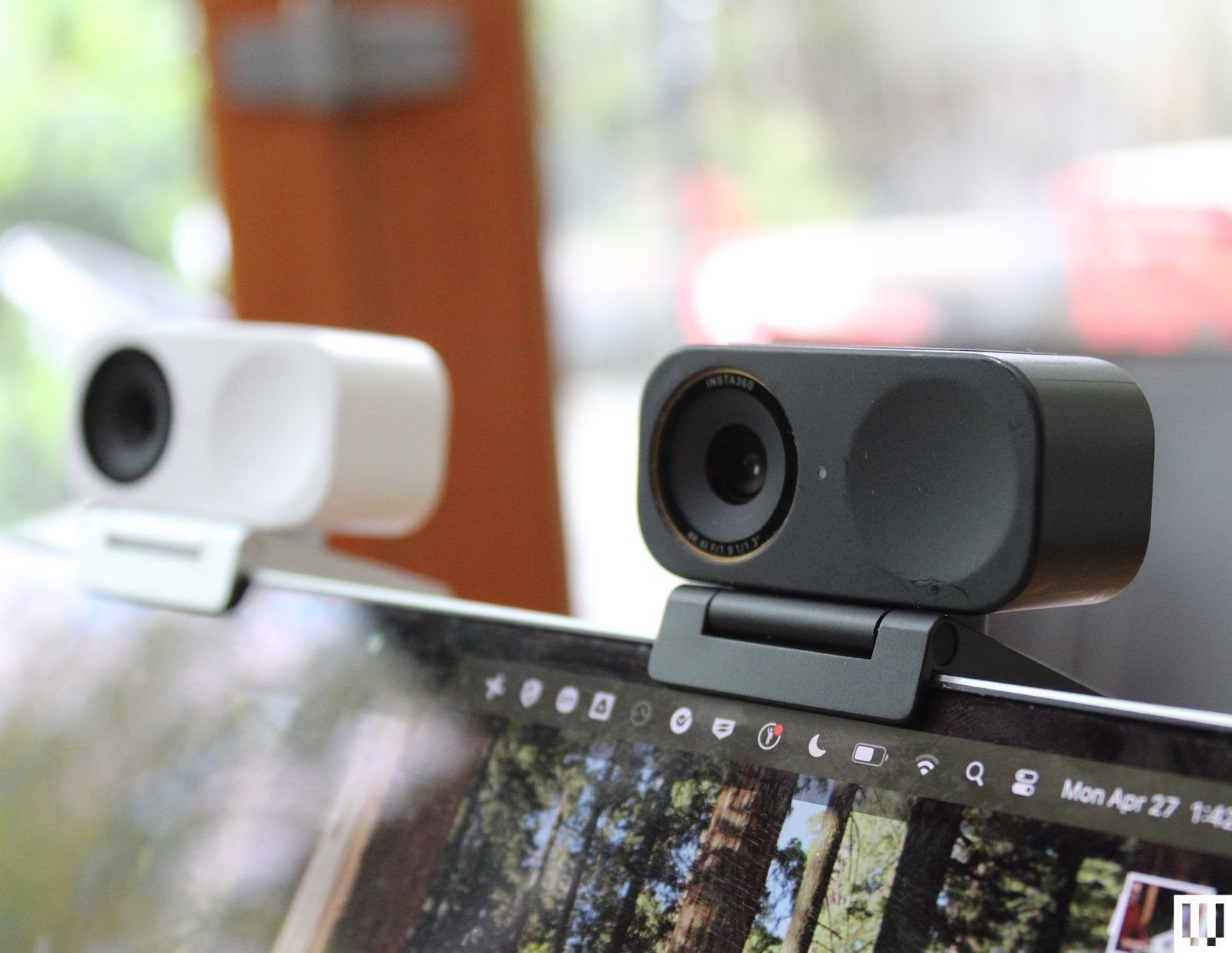Two advanced rectangular webcams clipped atop laptop screen