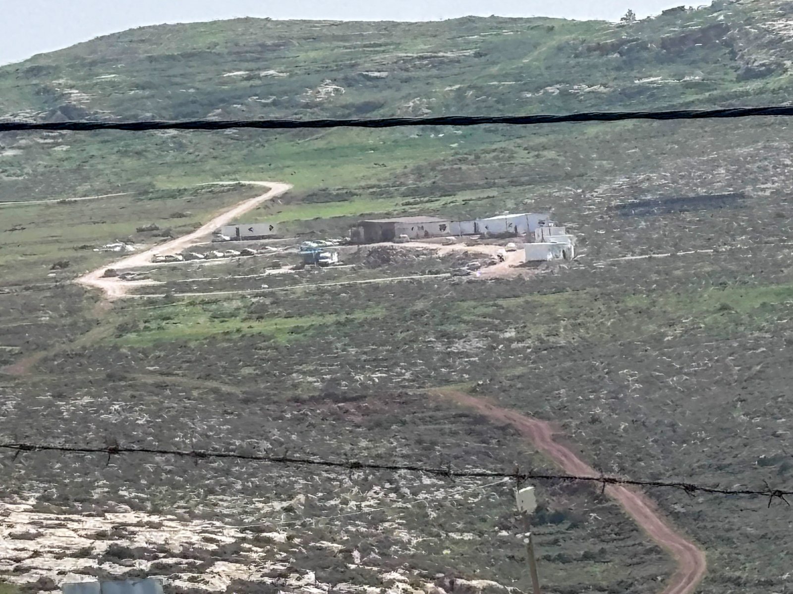 Malachei HaShalom settlement overlooks grazing lands near Khirbet al-Marajim