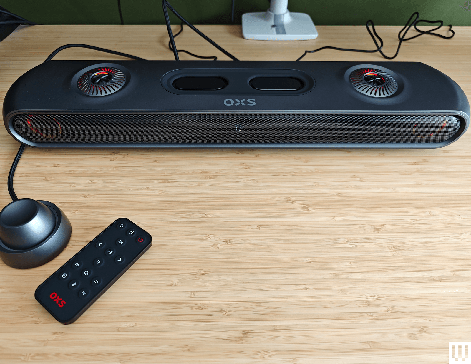 OXS Thunder Pro Dolby Atmos-certified soundbar beneath ultrawide monitor