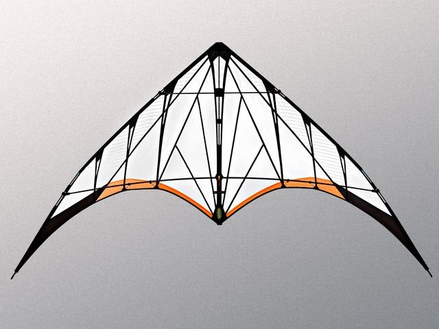 High-performance stunt kite soaring against clear blue sky