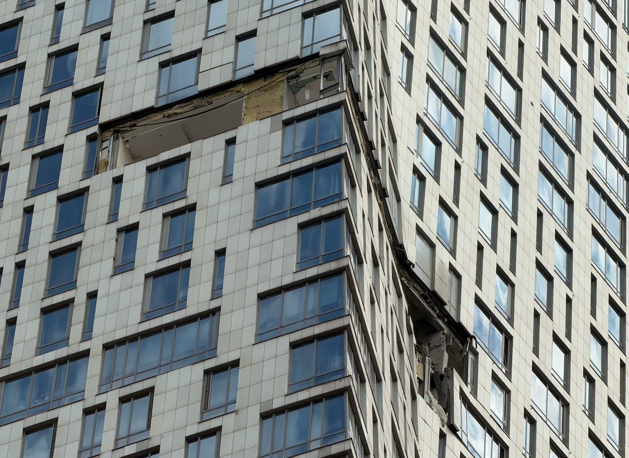 Damage to windows and walls after drone attack on high-rise building