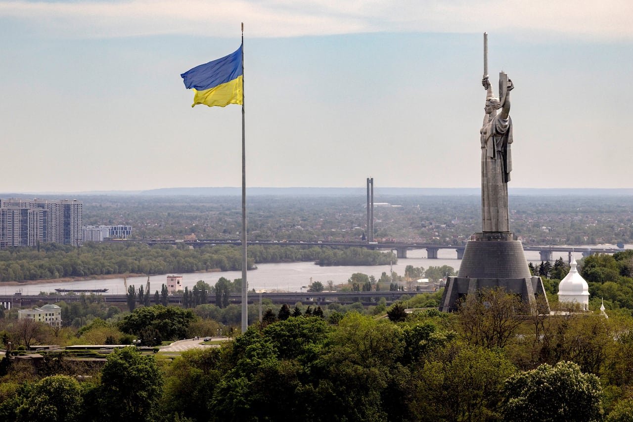 Ukrainian flag flying near Motherland monument in Kyiv