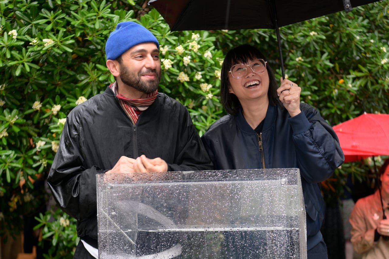 Artist Abbas Akhavan standing beside curator Kim Nguyen inside Canadian pavilion
