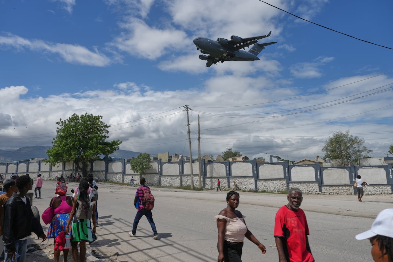 Cargo plane landing at Toussaint Louverture International Airport amid unrest